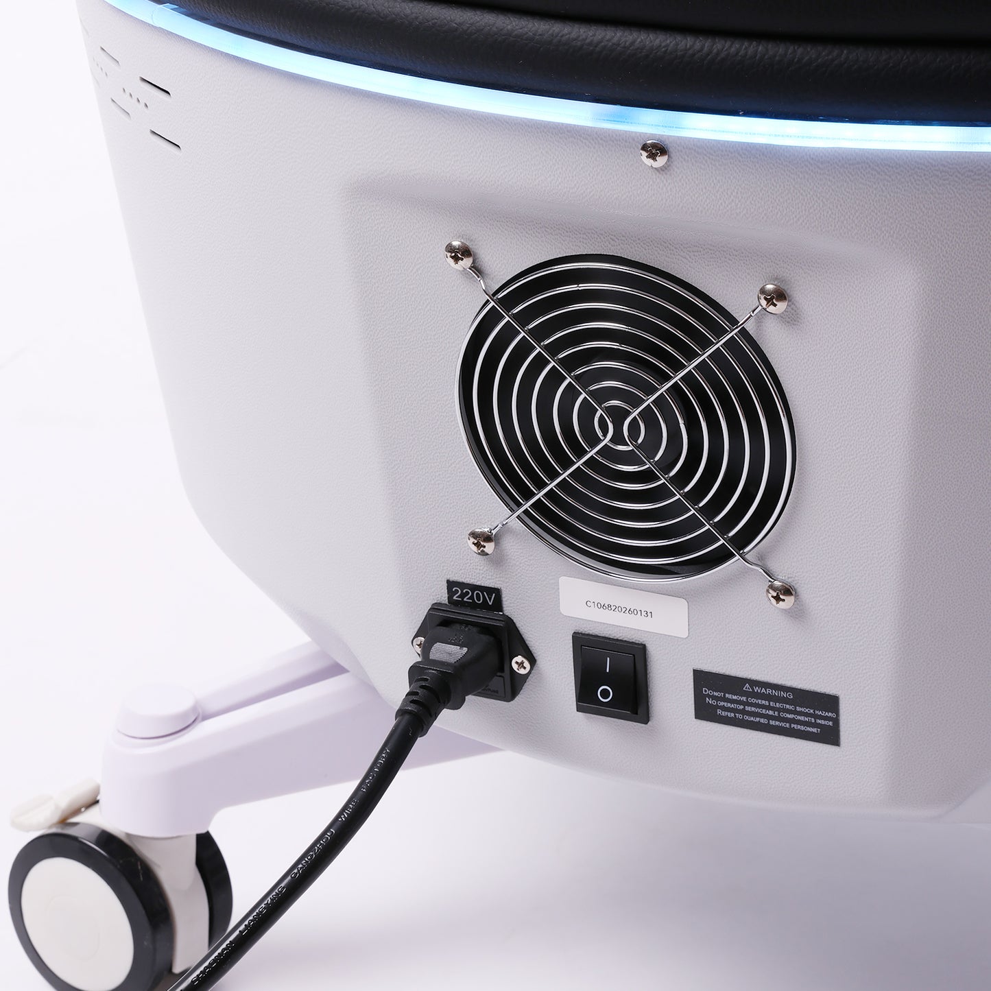 Rear view of pelvic therapy chair showing power connection and cooling system design