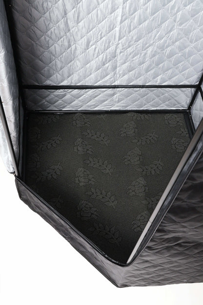 Close-up of the sauna tent’s patterned interior floor.
