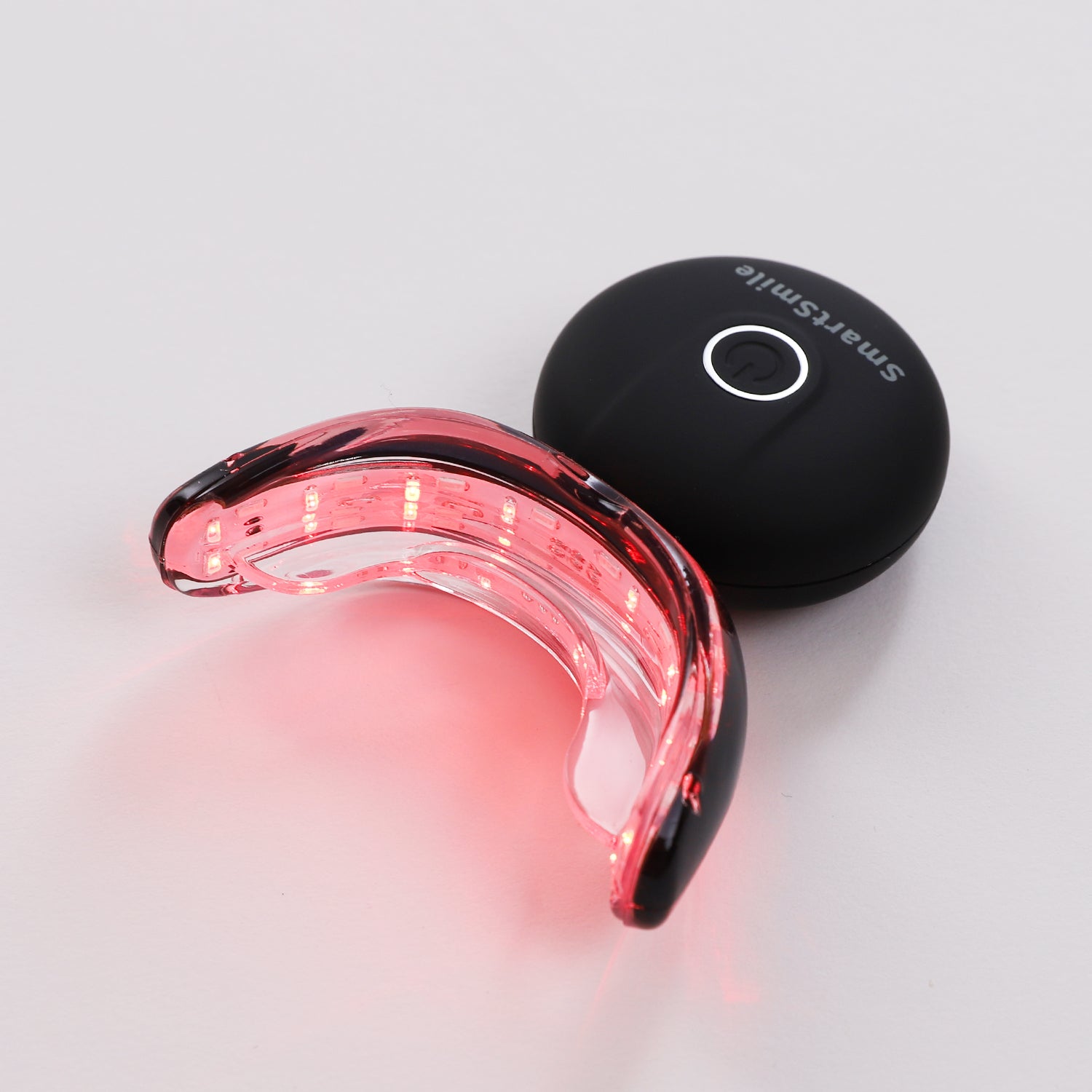 Red light SmartSmile tray for enhanced oral hygiene and gum care.