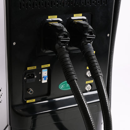 Close-up of the rear electrical and connection panel of a black industrial machine,