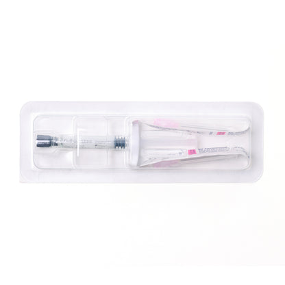 Medical syringe and tube in clear packaging on a white background