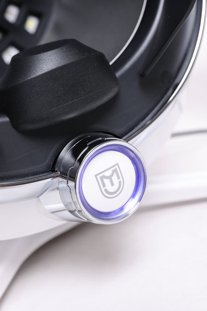 Detail view of AI skin scanner power button with illuminated design and modern aesthetic