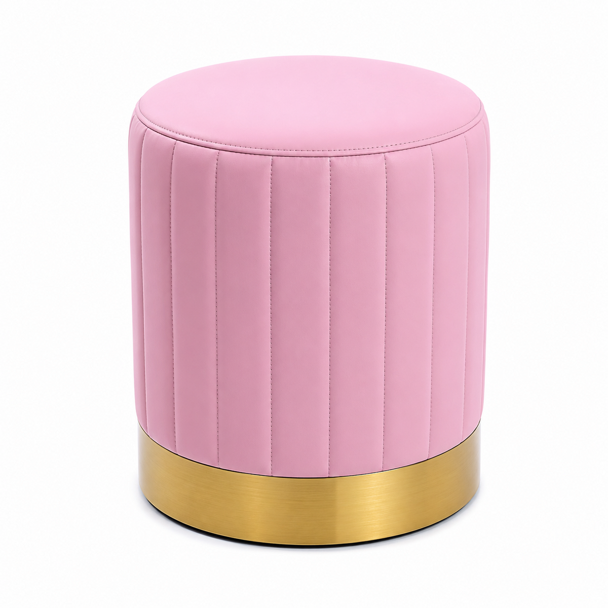 A round pink upholstered ottoman with vertical channel tufting and a brushed gold metal base.