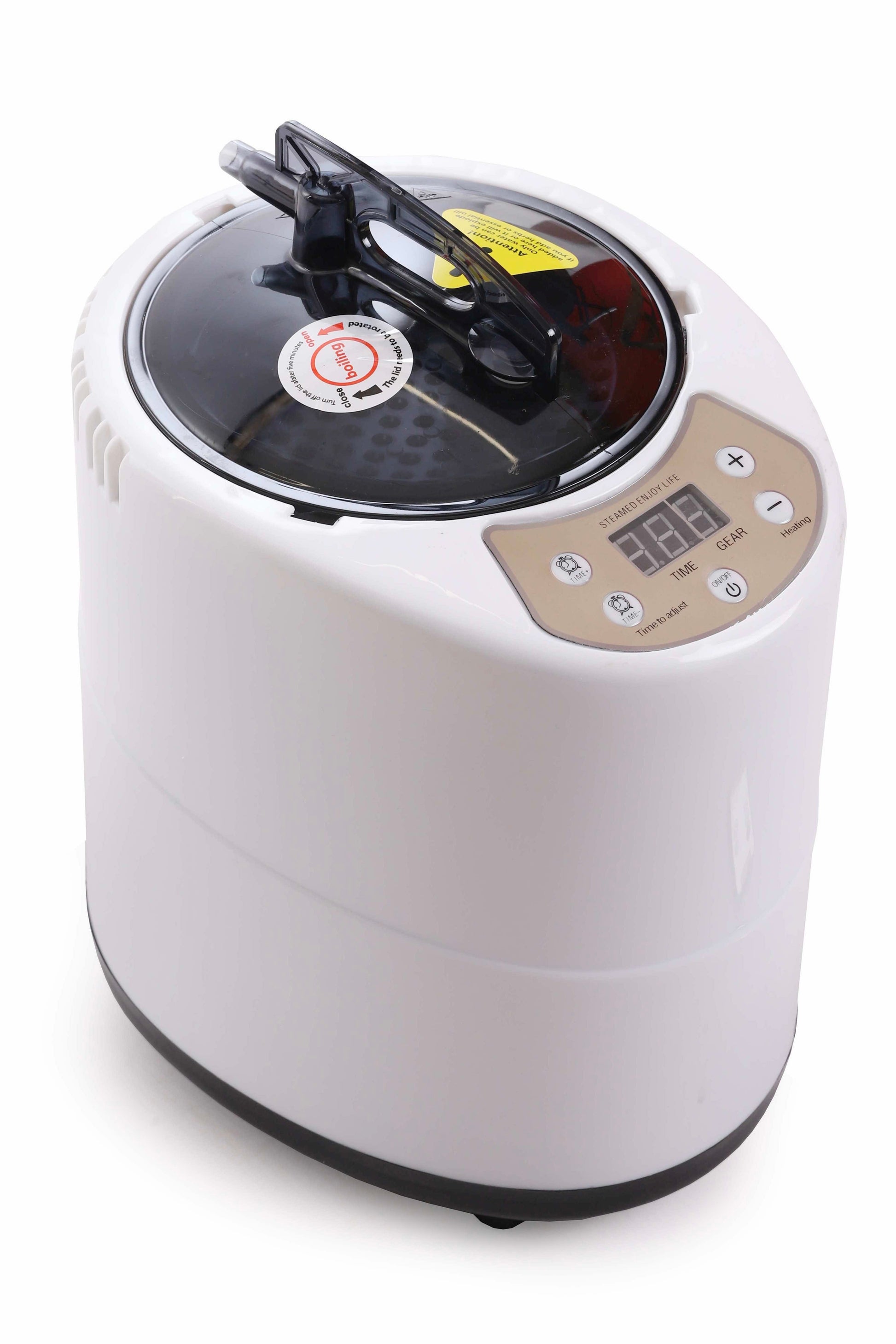 Close-up of the digital smart steam generator unit with control panel and black lid.