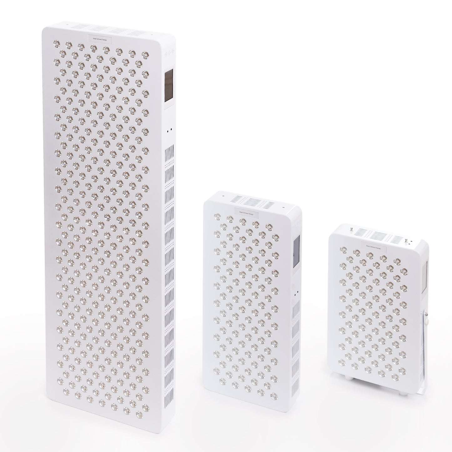 Three different sizes of red and infrared LED light therapy panels displayed upright for comparison.