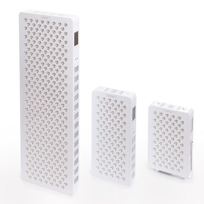 Three different sizes of red and infrared LED light therapy panels displayed upright for comparison.