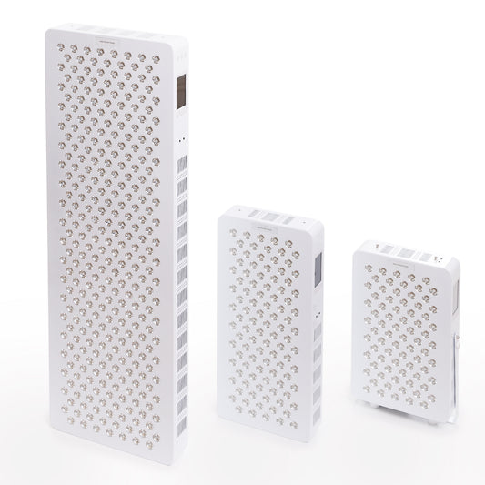 Three different sizes of red and infrared LED light therapy panels displayed upright for comparison.
