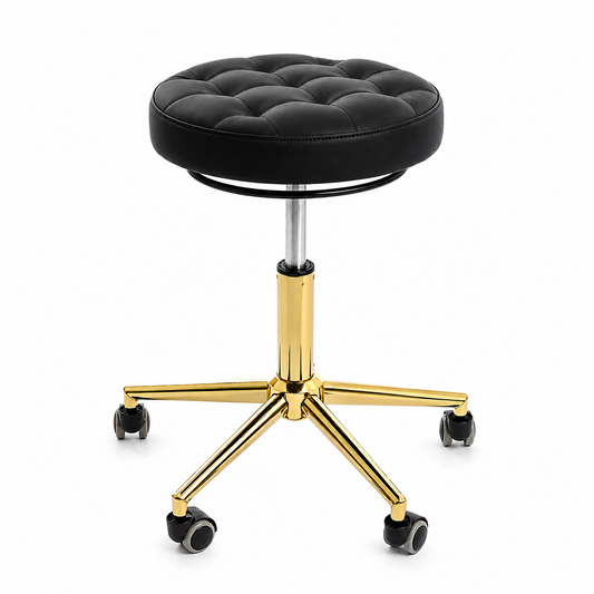 A black tufted round rolling stool with a polished gold five-star base.
