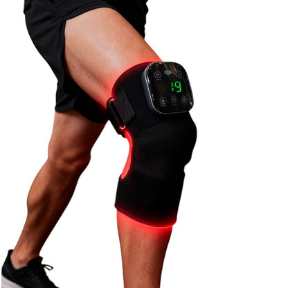 Red light Knee brace with digital display on a person's knee, glowing red.