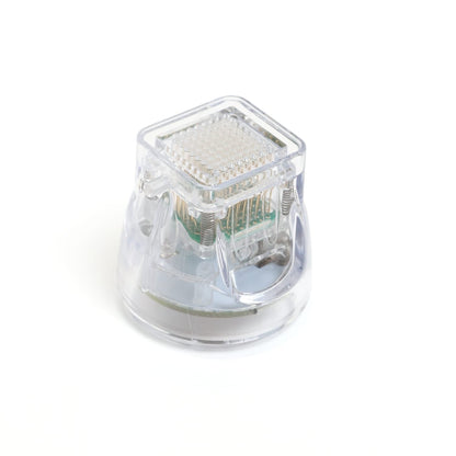 Clear plastic component with metallic interior on a white background